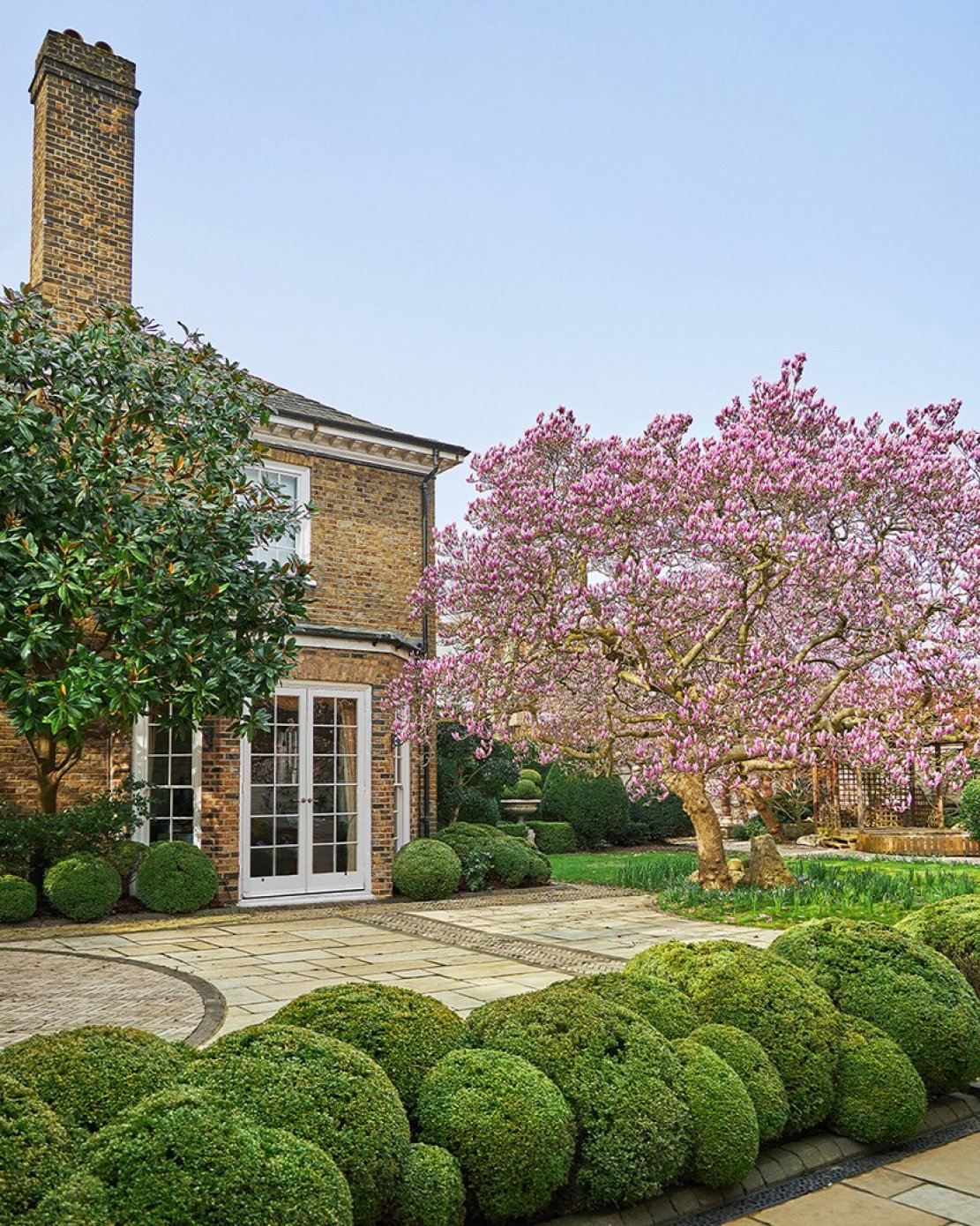 Zákoutí londýnského domu Garden Lodge se zahradou.
